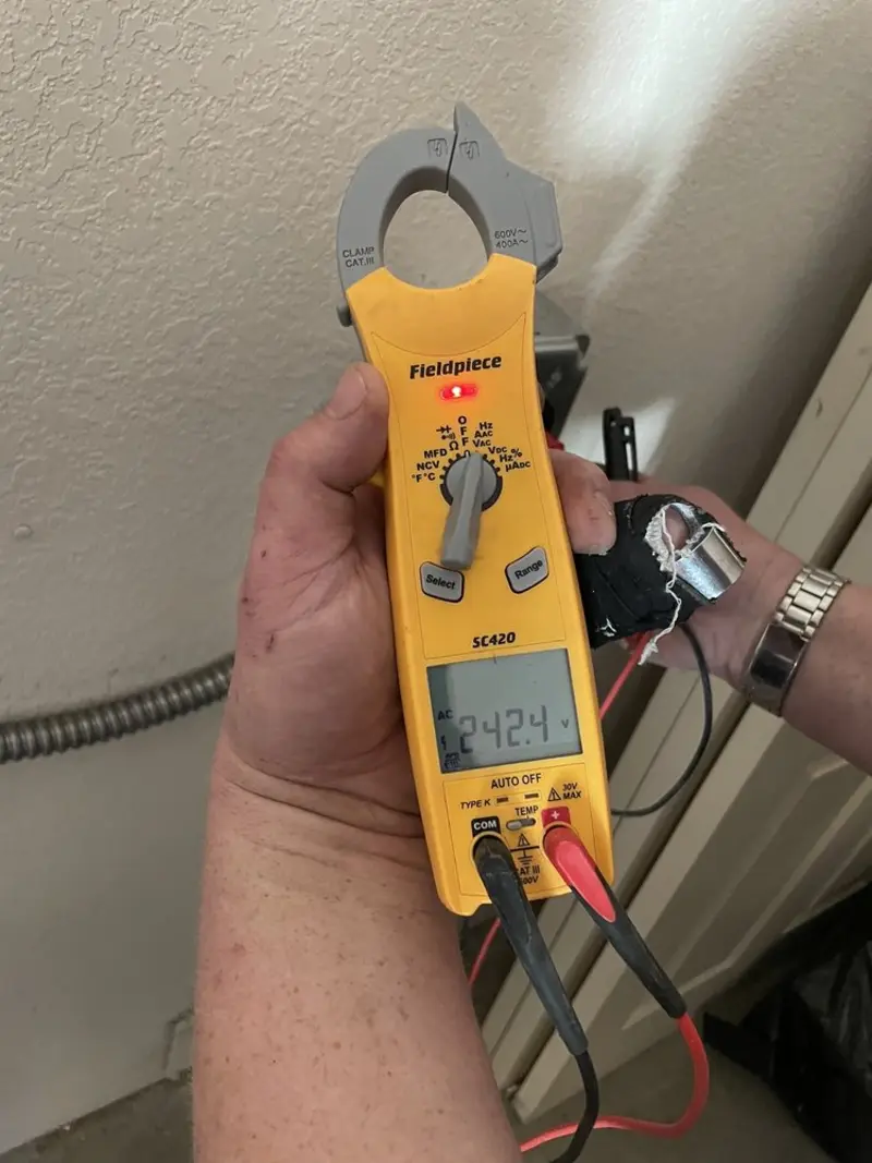Voltage testing with clamp meter during Hot Tub / Pool Electrical Wiring in Tecumseh